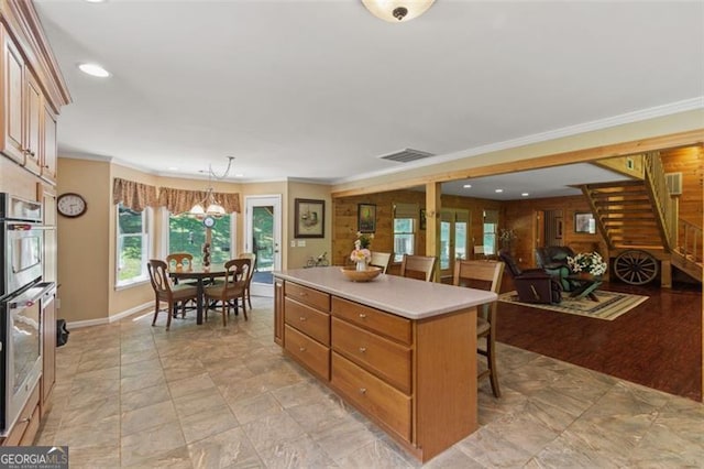 122 Gold View Dr, Dahlonega, GA 30533 - kitchen featuring a kitchen breakfast bar, light countertops, a kitchen island, baseboards, and recessed lighting
