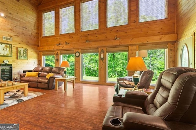 122 Gold View Dr, Dahlonega, GA 30533 - living area featuring a towering ceiling, wood walls, and wood finished floors