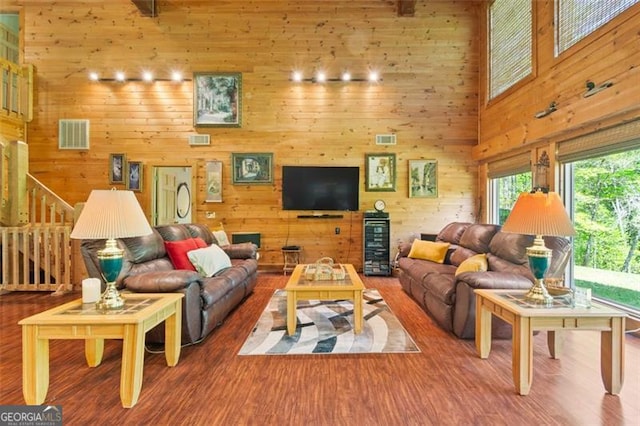 122 Gold View Dr, Dahlonega, GA 30533 - living area featuring wood finished floors, a towering ceiling, wooden walls, and stairway
