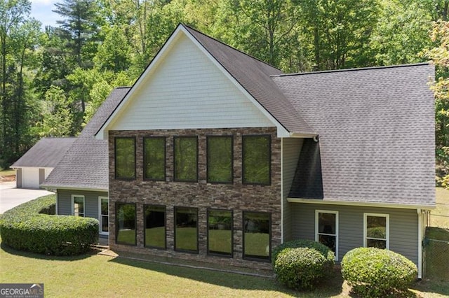 122 Gold View Dr, Dahlonega, GA 30533 - view of front of home with stone siding, a front yard, and a shingled roof