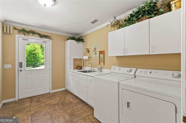 122 Gold View Dr, Dahlonega, GA 30533 - laundry area with cabinet space, washer and dryer, crown molding, baseboards, and stone finish floors