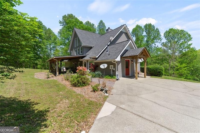 122 Gold View Dr, Dahlonega, GA 30533 - view of front facade featuring a front yard, a chimney, concrete driveway, and roof with shingles