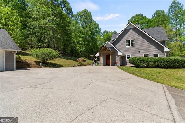 122 Gold View Dr, Dahlonega, GA 30533 - view of front facade with a chimney, a front yard, and driveway