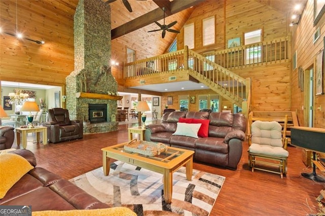 122 Gold View Dr, Dahlonega, GA 30533 - living room featuring high vaulted ceiling, ceiling fan, wood finished floors, a fireplace, and wooden ceiling with exposed beams