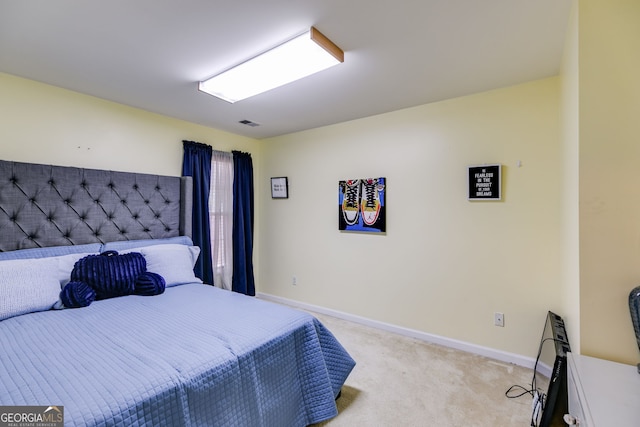 bedroom with baseboards, carpet, and visible vents