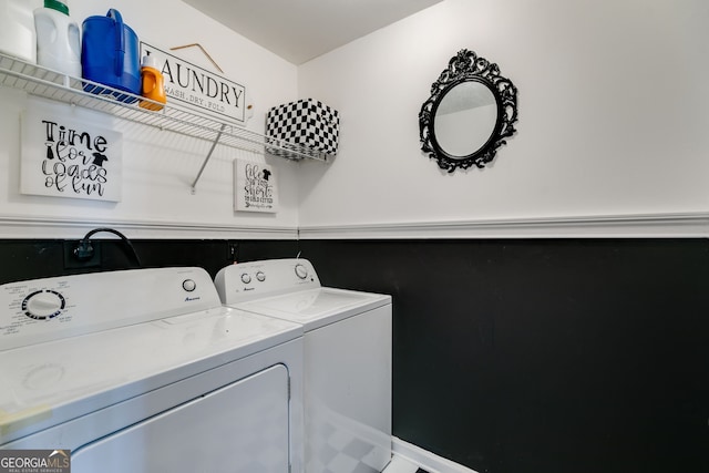 washroom with laundry area and washer and dryer