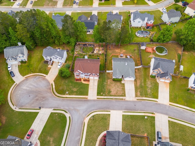 birds eye view of property with a residential view
