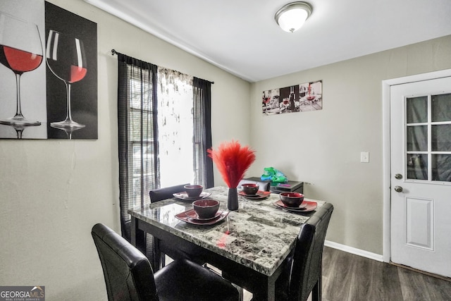 106 Vickie Dr, Warner Robins, GA 31093 - dining space featuring baseboards, dark wood finished floors, and lofted ceiling