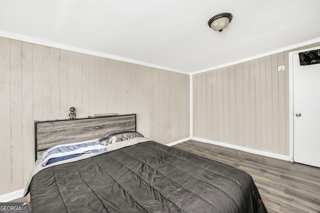 106 Vickie Dr, Warner Robins, GA 31093 - bedroom featuring wooden walls, baseboards, and wood finished floors