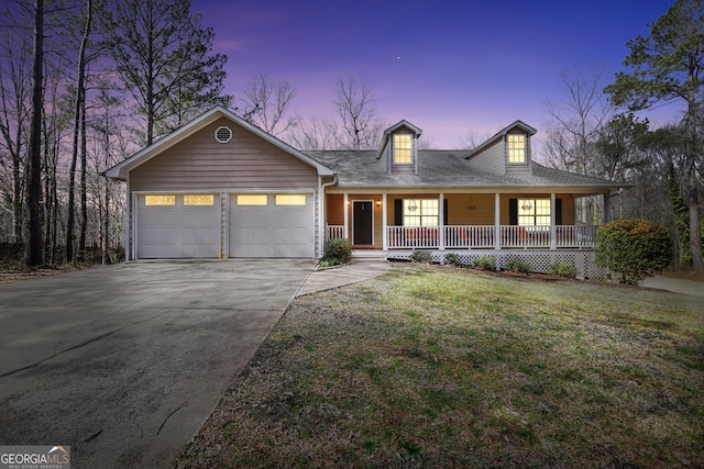 175 Laney Ct, Mcdonough, GA 30252 - view of front of house featuring a porch, a lawn, concrete driveway, and a garage