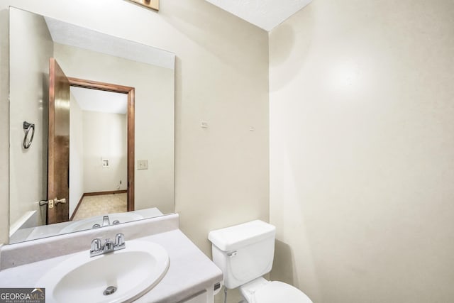 175 Laney Ct, Mcdonough, GA 30252 - bathroom featuring vanity, baseboards, and toilet