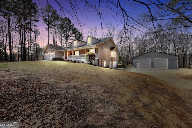 175 Laney Ct, Mcdonough, GA 30252 - property exterior at dusk with a garage, an outdoor structure, a porch, and driveway