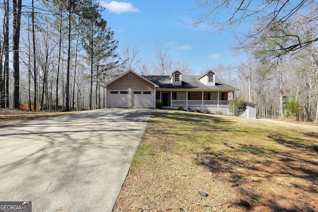 175 Laney Ct, Mcdonough, GA 30252 - cape cod house featuring covered porch, an attached garage, concrete driveway, and a front lawn