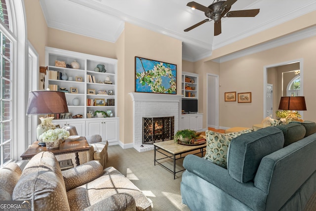 living area with plenty of natural light, ornamental molding, and a ceiling fan