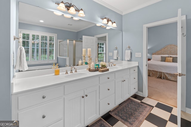 ensuite bathroom featuring double vanity, tile patterned floors, a shower stall, and a sink