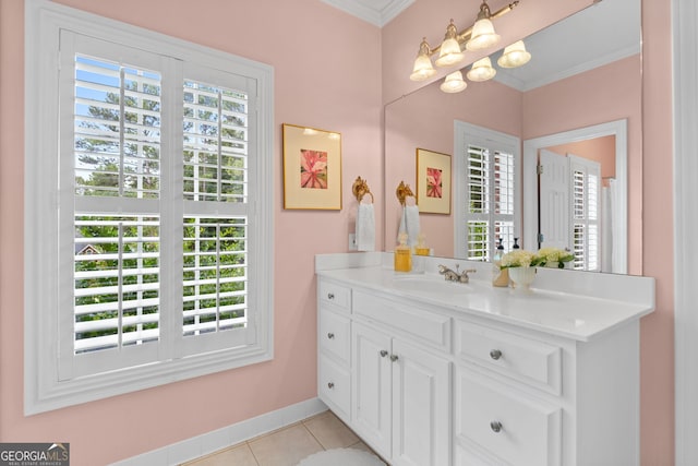 bathroom featuring tile patterned floors, ornamental molding, a wealth of natural light, and vanity