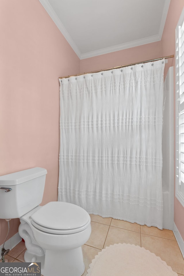 full bath featuring crown molding, tile patterned floors, baseboards, and toilet
