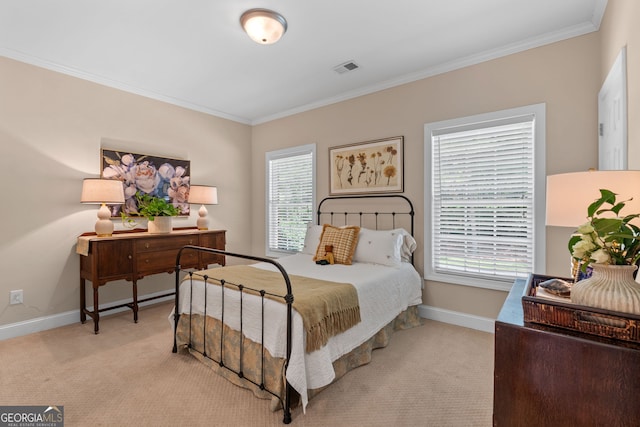 bedroom with baseboards, ornamental molding, visible vents, and light carpet