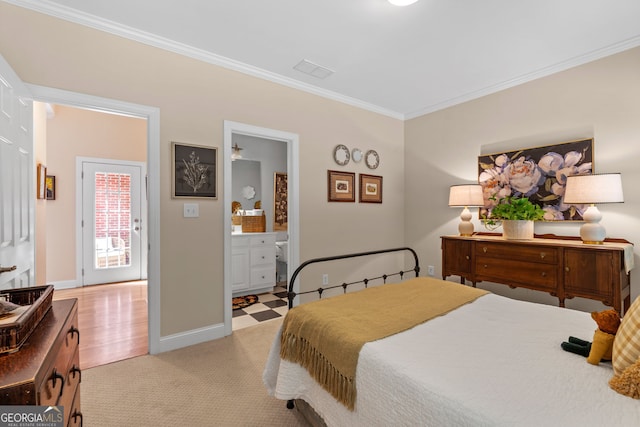 bedroom with visible vents, light colored carpet, baseboards, connected bathroom, and ornamental molding