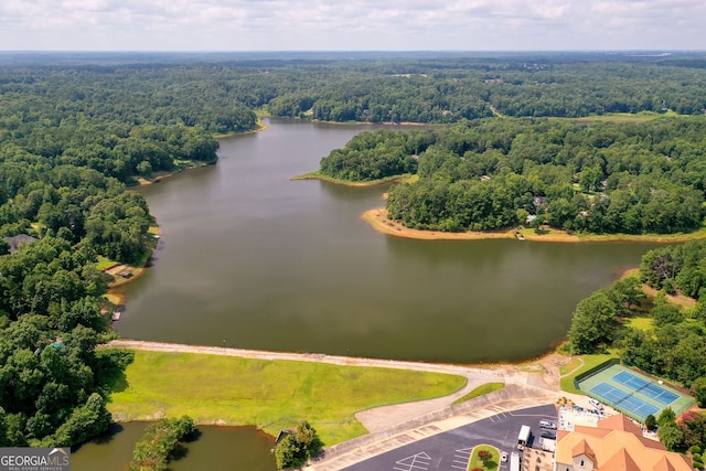 drone / aerial view featuring a water view and a view of trees