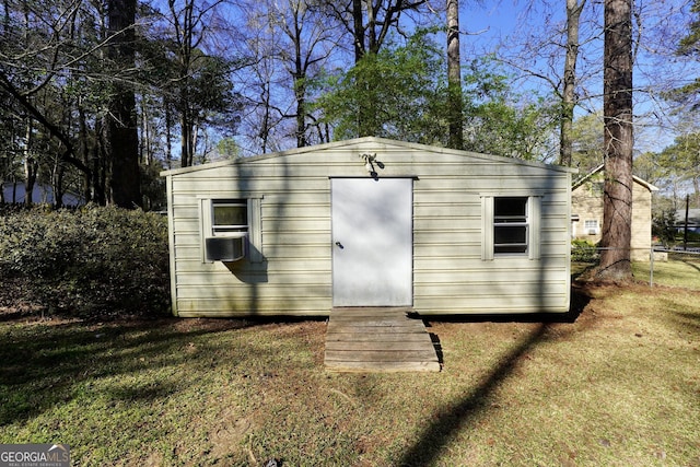 view of shed featuring fence