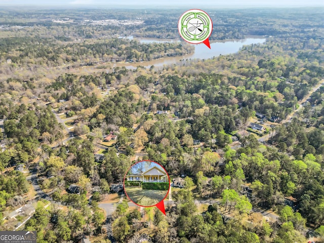 bird's eye view featuring a water view and a wooded view