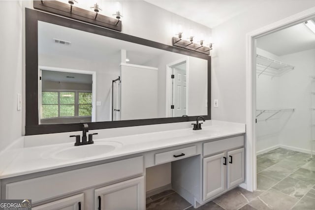 1931 Abinger Way, Lawrenceville, GA 30043 - bathroom with double vanity and a spacious closet