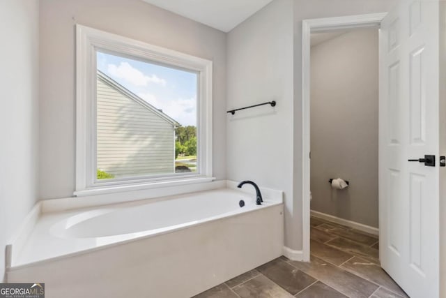1931 Abinger Way, Lawrenceville, GA 30043 - full bath featuring baseboards and a bath
