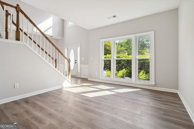 1931 Abinger Way, Lawrenceville, GA 30043 - foyer entrance featuring baseboards, visible vents, wood finished floors, and stairway