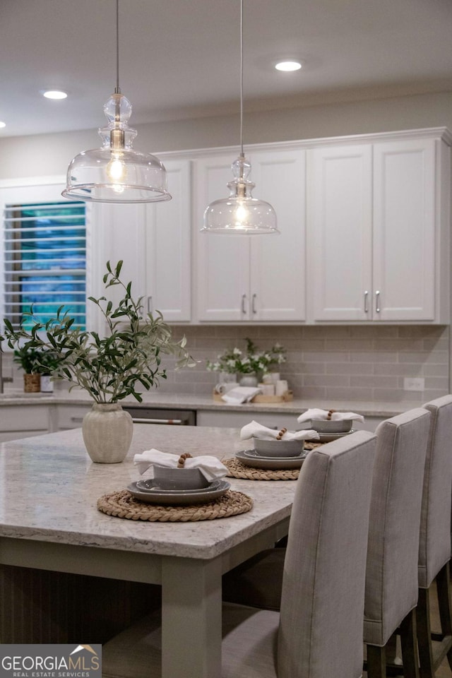 dining space featuring recessed lighting