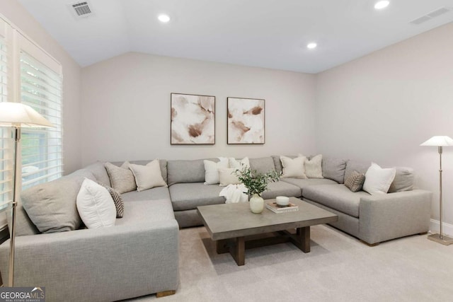 living area featuring carpet flooring, recessed lighting, visible vents, and lofted ceiling