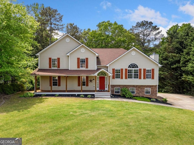405 Maple Rdg, White, GA 30184 - tri-level home featuring a porch, a chimney, and a front lawn