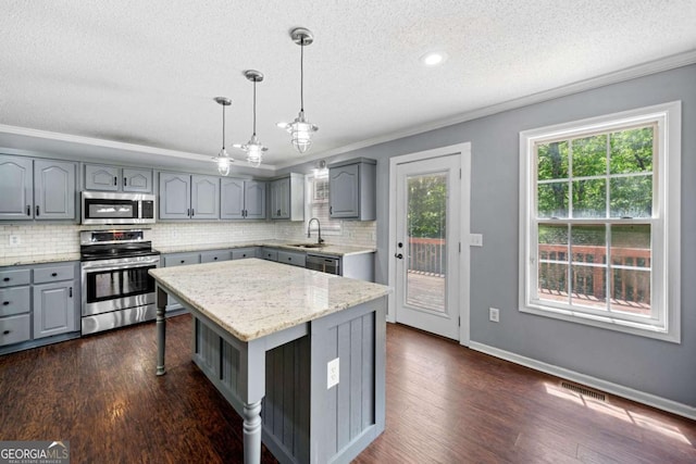 405 Maple Rdg, White, GA 30184 - kitchen with stainless steel appliances, ornamental molding, and gray cabinets