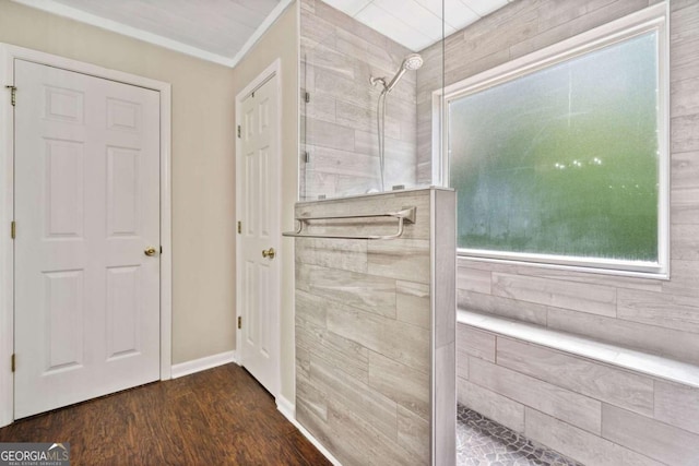 405 Maple Rdg, White, GA 30184 - bathroom with baseboards, wood finished floors, and a tile shower