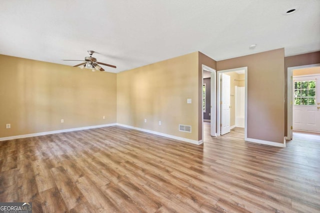 405 Maple Rdg, White, GA 30184 - unfurnished living room with baseboards, light wood-style flooring, ceiling fan, and visible vents