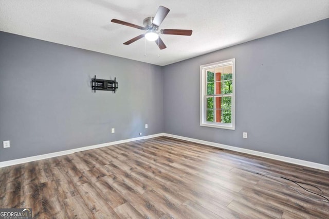405 Maple Rdg, White, GA 30184 - unfurnished room featuring baseboards, ceiling fan, and wood finished floors