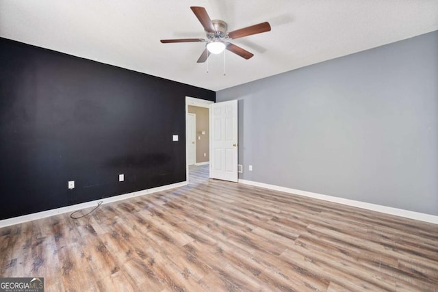 405 Maple Rdg, White, GA 30184 - unfurnished room featuring baseboards, ceiling fan, and wood finished floors