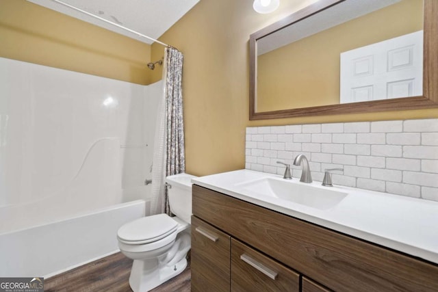 405 Maple Rdg, White, GA 30184 - bathroom with shower / bath combo with shower curtain, vanity, wood finished floors, toilet, and backsplash