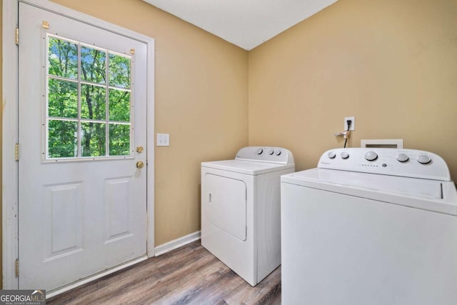405 Maple Rdg, White, GA 30184 - washroom with laundry area, wood finished floors, separate washer and dryer, and a healthy amount of sunlight