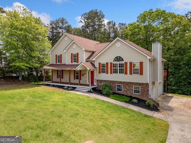 405 Maple Rdg, White, GA 30184 - tri-level home with a porch, a chimney, a garage, a front lawn, and concrete driveway