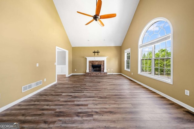 405 Maple Rdg, White, GA 30184 - unfurnished living room featuring visible vents, a ceiling fan, a fireplace with raised hearth, and high vaulted ceiling