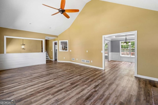 405 Maple Rdg, White, GA 30184 - unfurnished living room featuring visible vents, dark wood finished floors, ceiling fan with notable chandelier, and high vaulted ceiling