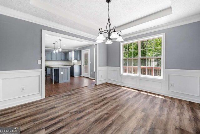 405 Maple Rdg, White, GA 30184 - unfurnished dining area featuring an inviting chandelier, a textured ceiling, and a raised ceiling