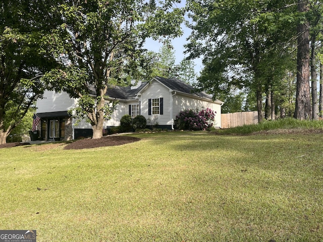 view of front of property with fence and a front yard
