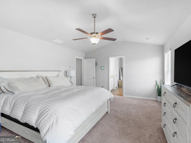 bedroom featuring baseboards, lofted ceiling, visible vents, and light carpet