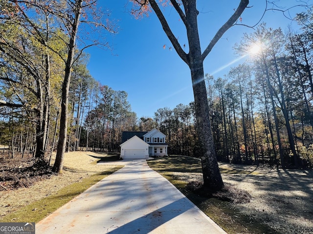 view of front of property featuring a garage and concrete driveway