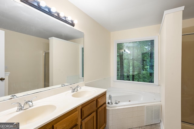 6939 Waters Edge Dr, Stone Mountain, GA 30087 - full bathroom featuring a jetted tub, visible vents, a sink, and a stall shower