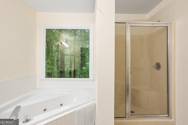 6939 Waters Edge Dr, Stone Mountain, GA 30087 - full bath with a tub with jets, a stall shower, and visible vents