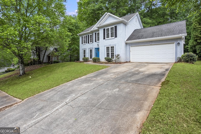 6939 Waters Edge Dr, Stone Mountain, GA 30087 - colonial house featuring a garage, a front lawn, driveway, and a shingled roof