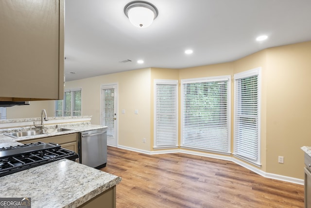6939 Waters Edge Dr, Stone Mountain, GA 30087 - kitchen with baseboards, light wood-type flooring, recessed lighting, a sink, and dishwasher